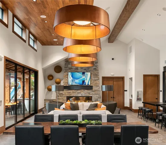 a living room with fireplace furniture and a large window