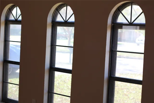 a view of front door with a mirror