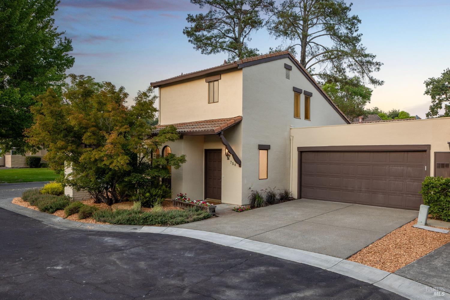 754 Adobe Drive Santa Rosa, CA 95404 - Photo 1 of 1 a front view of a house with a yard and garage