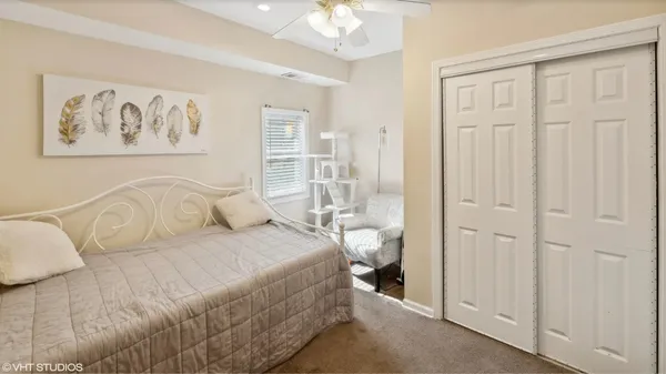 a spacious bedroom with a bed and a window