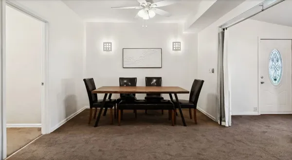 a view of a dining room with furniture
