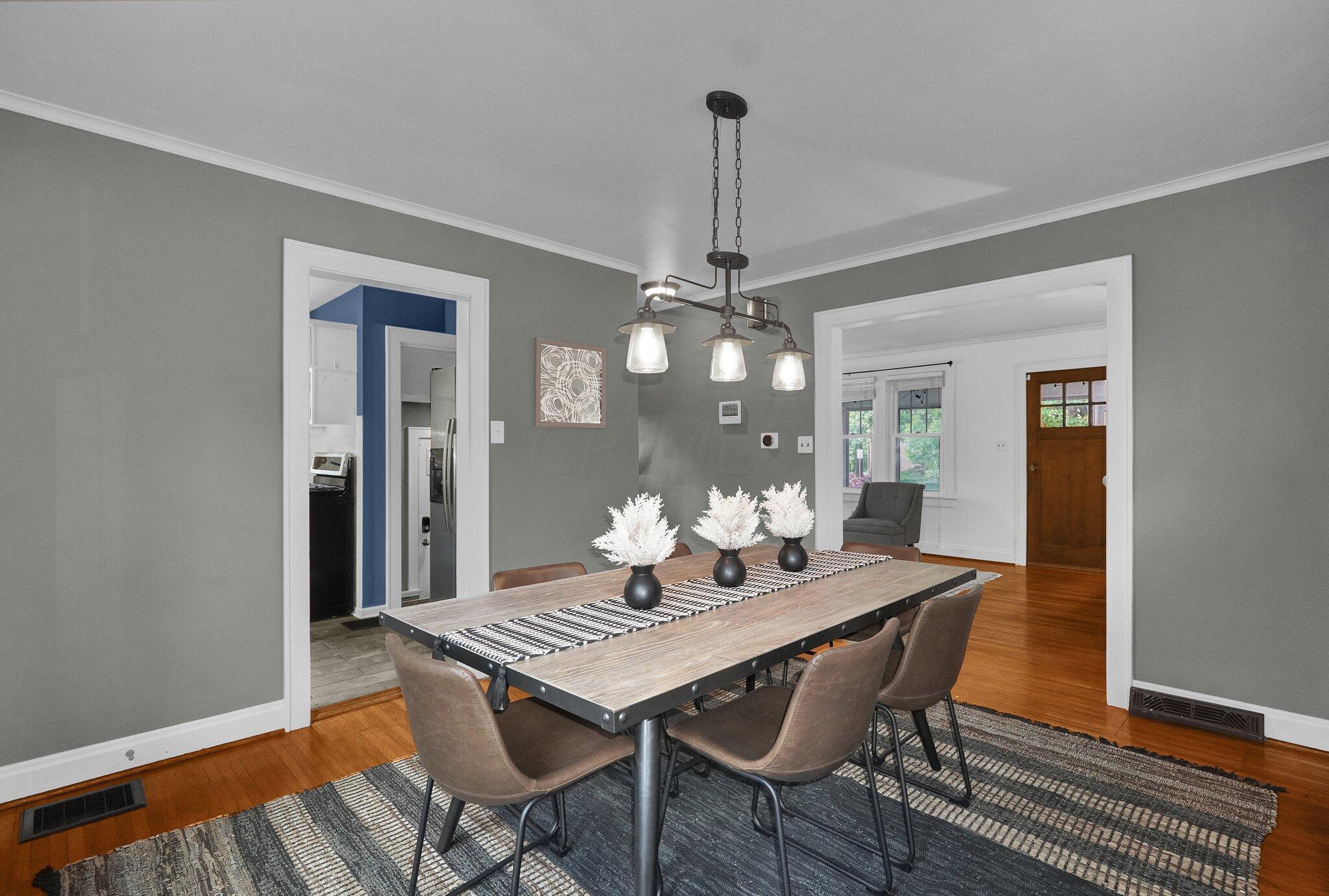 461 Arden Road Columbus, OH 43214 - Photo 10 of 42 Walk through the large opening into your formal dining room with updated light fixture. Room to host any time of year!