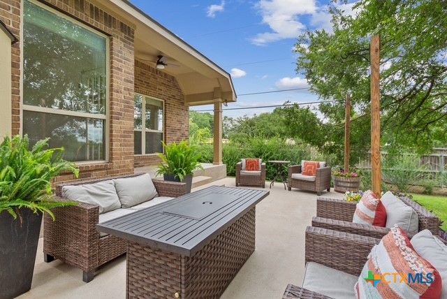 3306 Spring Canyon Road Belton, TX 76513 - Photo 36 of 40 a view of a patio with couches chairs and a potted plant