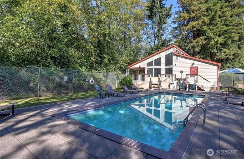 2411 South 248th Street, Unit D24 Kent, WA 98032 - Photo 20 of 21 a front view of a house with swimming pool and porch