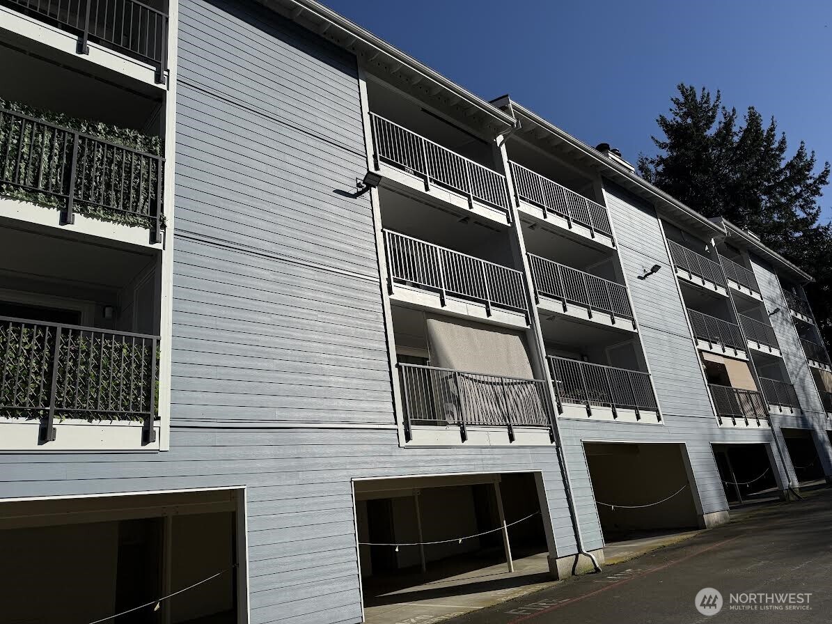 2411 South 248th Street, Unit D24 Kent, WA 98032 - Photo 2 of 21 a front view of a building with a door
