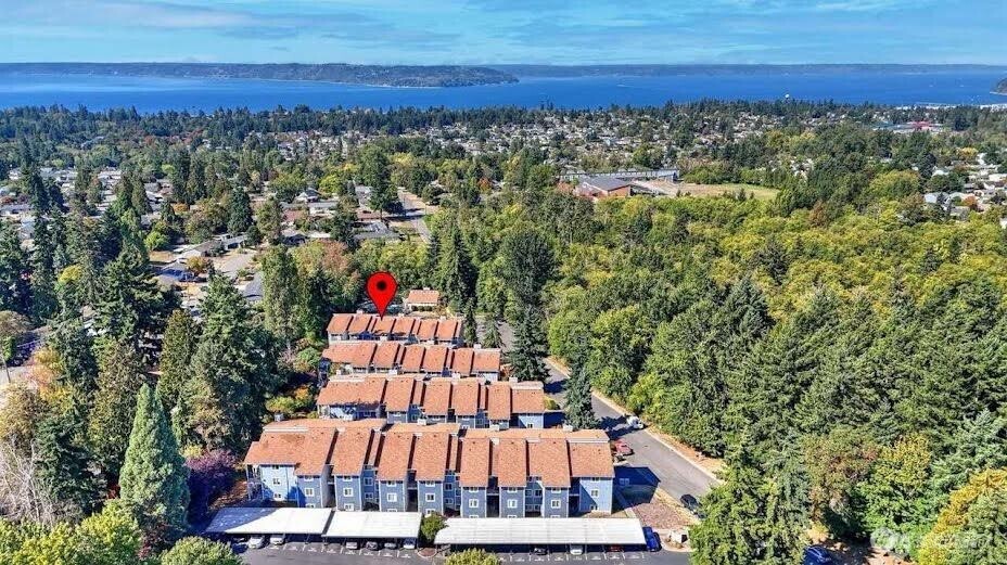 2411 South 248th Street, Unit D24 Kent, WA 98032 - Photo 21 of 21 a view of swimming pool with outdoor seating and yard in back