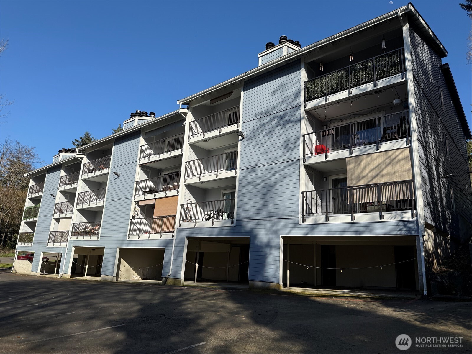 2411 South 248th Street, Unit D24 Kent, WA 98032 - Photo 3 of 21 a view of a building with a street