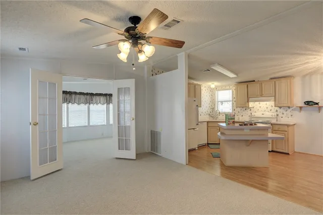 a view of a kitchen with a sink and dishwasher a kitchen view