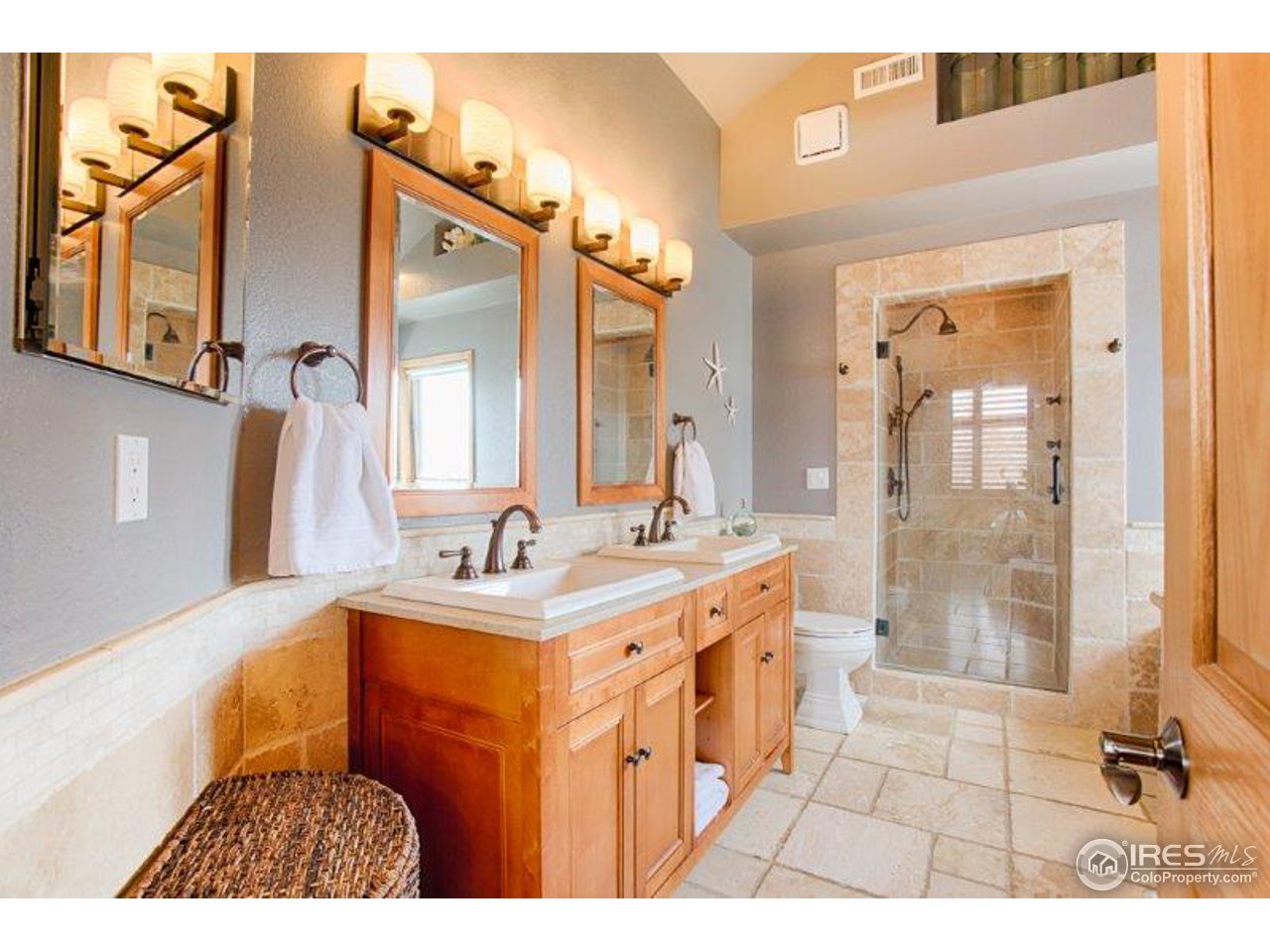1301 Riverside Avenue Boulder, CO 80304 - Photo 13 of 25 a bathroom with a sink a toilet and a mirror