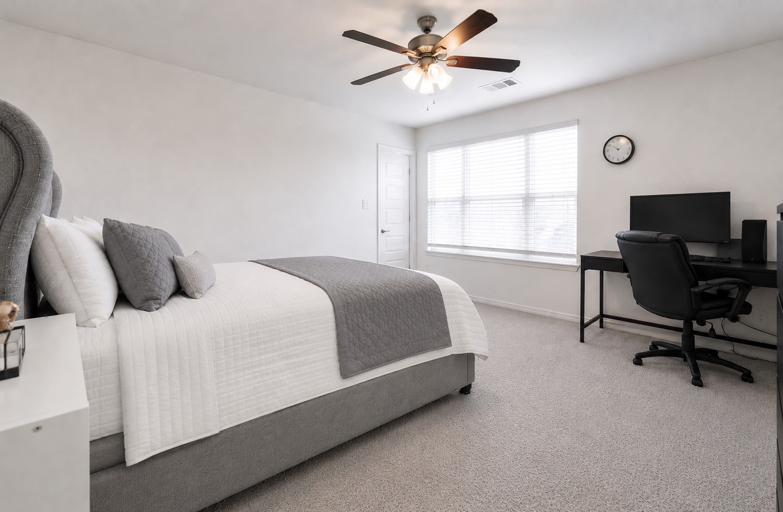 32418 Fly Fish Way Fulshear, TX 77441 - Photo 32 of 40 Guest bedroom number two is a generously sized room featuring plush carpet, a ceiling fan, and a large window that brings in plenty of natural light.