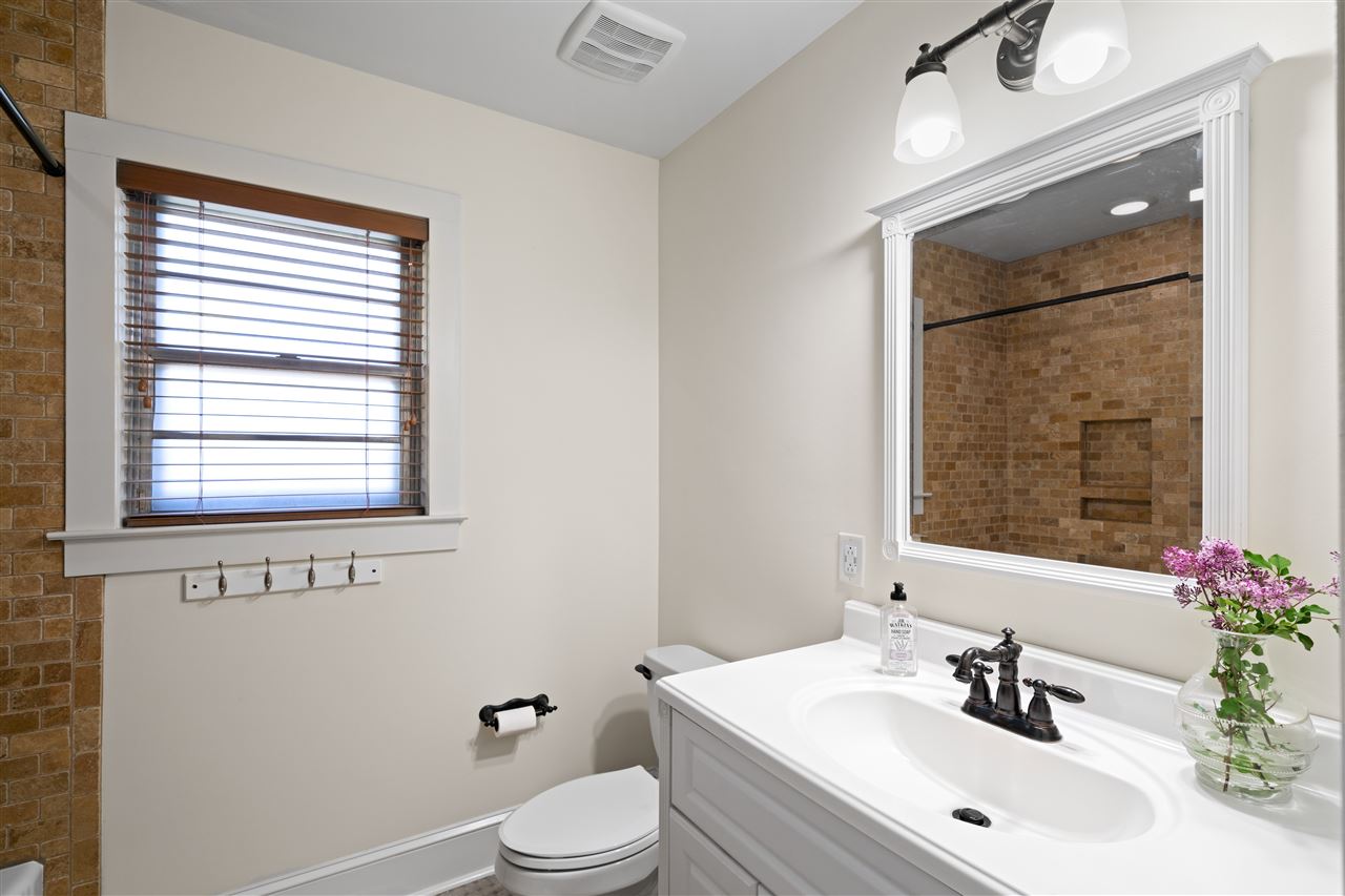 4165 Barfield Road Memphis, TN 38117 - Photo 17 of 24 Updated Hall Bath with Furniture Style Vanity and Custom Tilework in the Tub/Shower