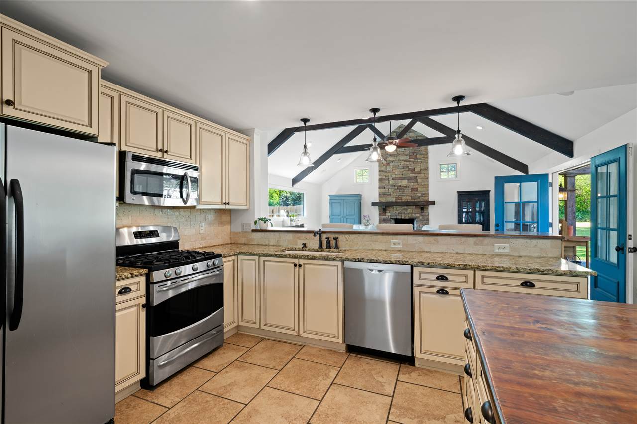 4165 Barfield Road Memphis, TN 38117 - Photo 24 of 24 You will LOVE the Open Floor Plan - Kitchen right off the 22x21 Hearth/Family Room with Soaring 14 ft Ceiling with Exposed Wood Beams and Floor-to-Ceiling Stacked Stone Fireplace! You stay connected to Guests/Family!