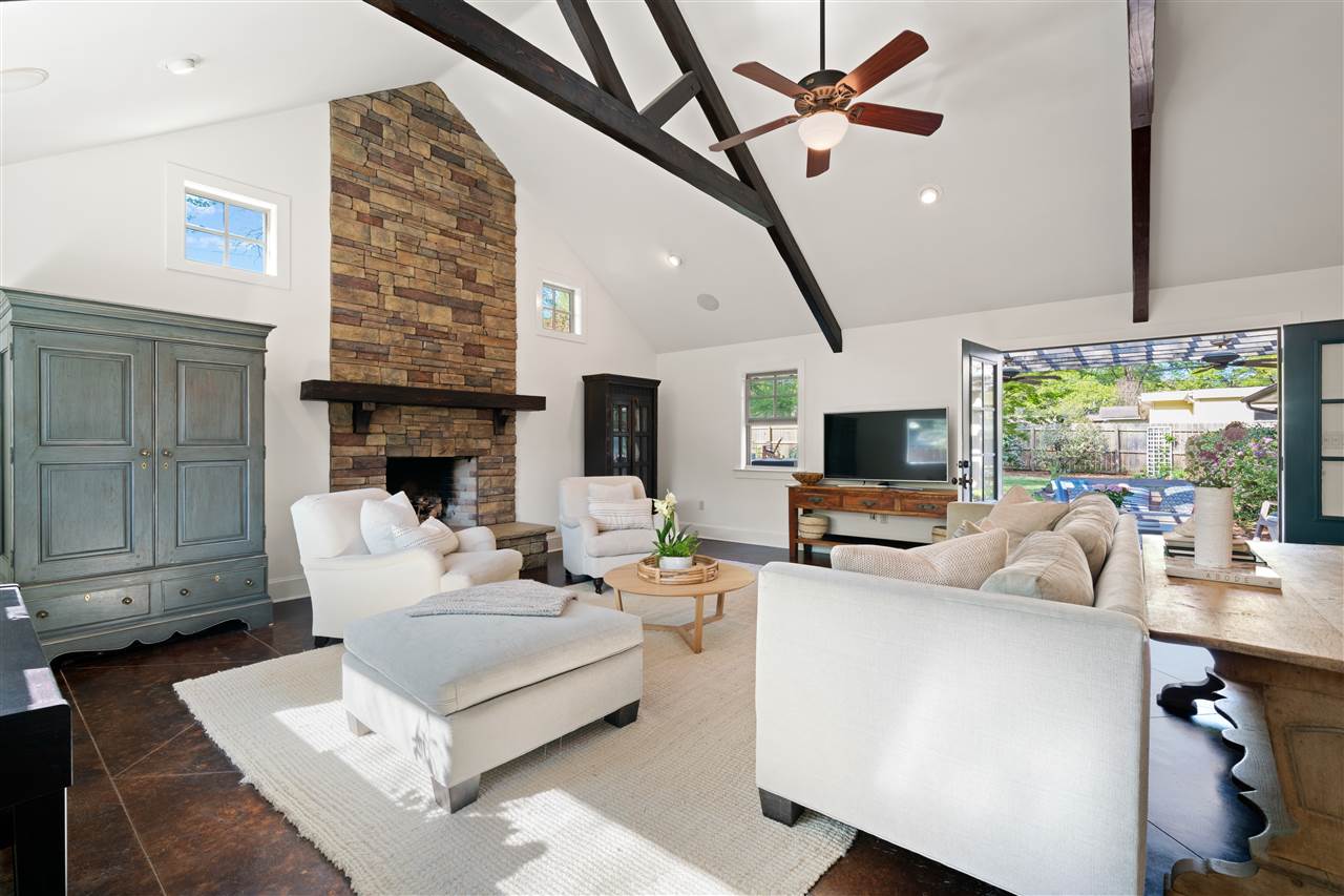 4165 Barfield Road Memphis, TN 38117 - Photo 9 of 24 22x21 Hearth/Family Room with Soaring 14 ft Ceiling with Exposed Wood Beams and Floor-to-Ceiling Stacked Stone Fireplace! Open to the Kitchen so you can stay connected to Guests/Family!