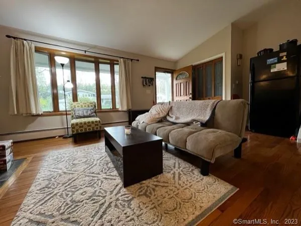 a living room with furniture and a rug