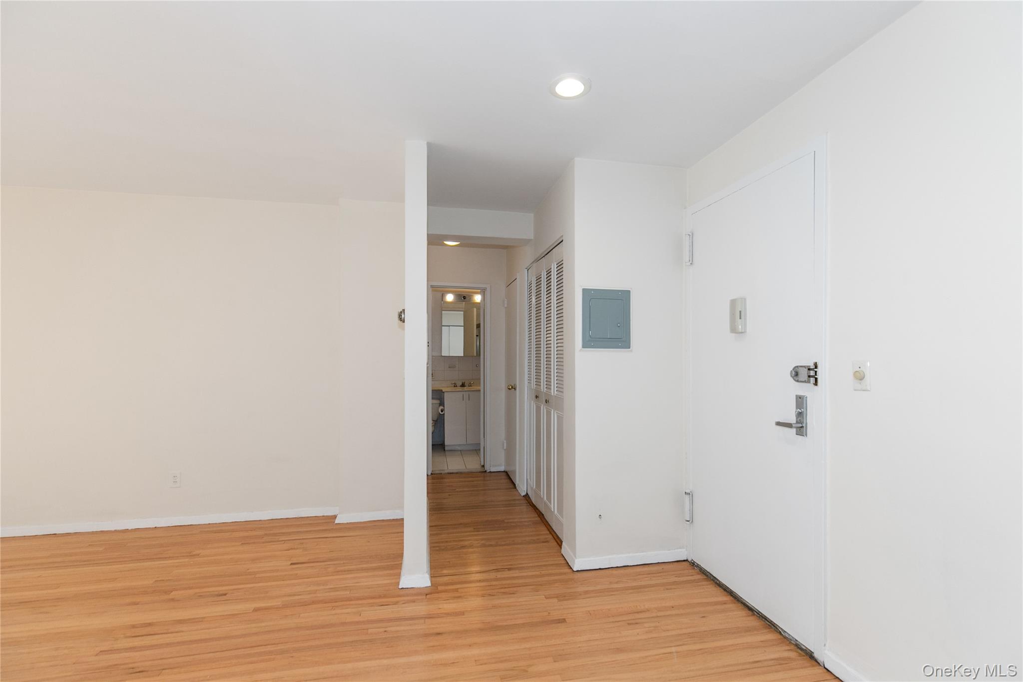 25 Park Place, Unit 2G Great Neck, NY 11021 - Photo 11 of 20 a view of a hallway with wooden floor