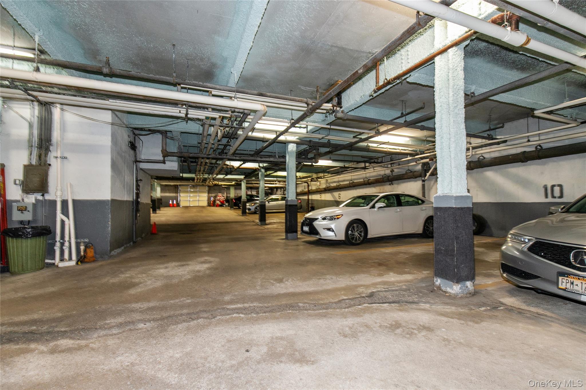 25 Park Place, Unit 2G Great Neck, NY 11021 - Photo 16 of 20 a view of parking garage with cars