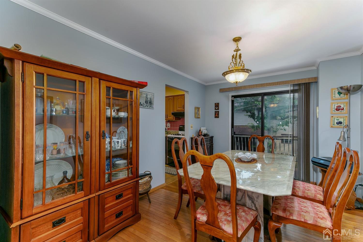 7303 Hana Road Edison, NJ 08817 - Photo 11 of 24 a view of a dining room with furniture window and outside view