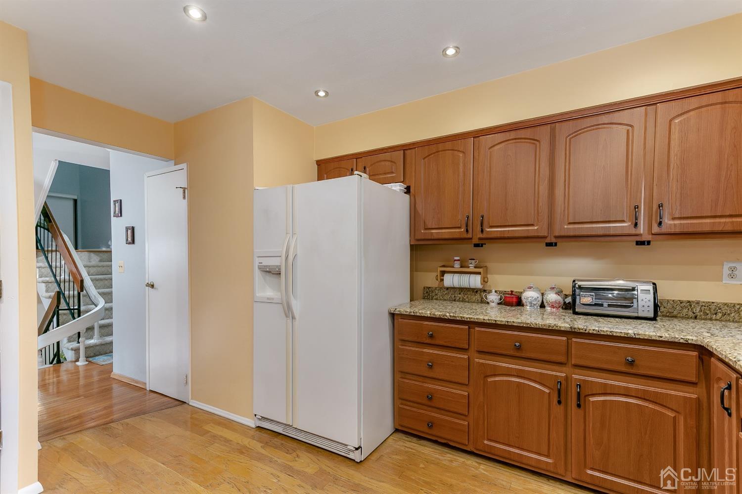 7303 Hana Road Edison, NJ 08817 - Photo 15 of 24 a kitchen with stainless steel appliances granite countertop a refrigerator and a stove