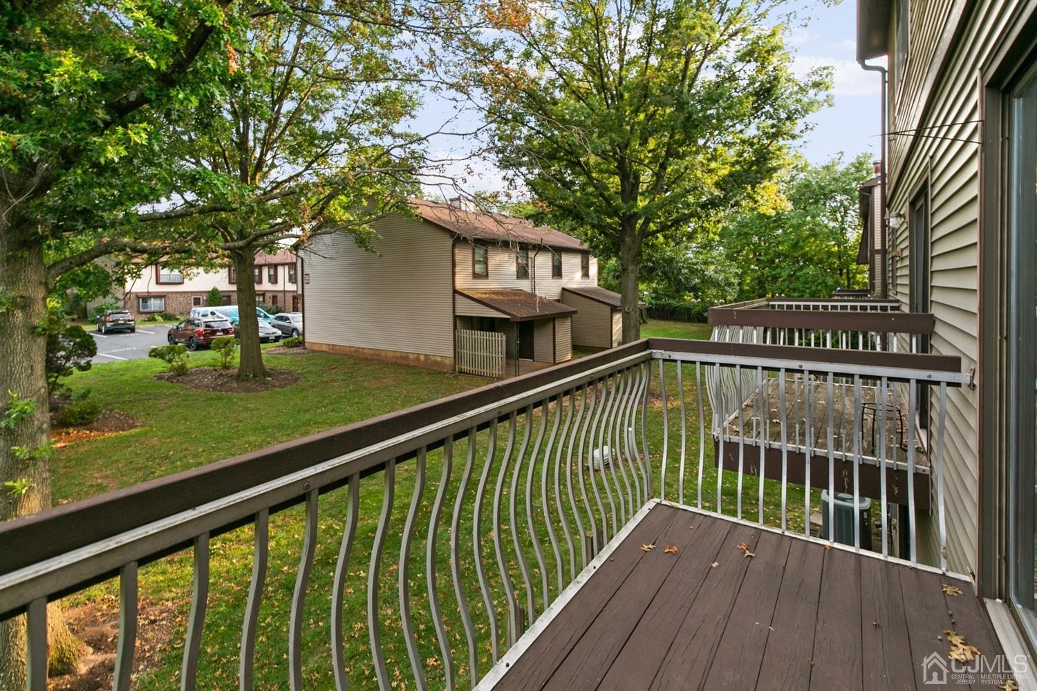 7303 Hana Road Edison, NJ 08817 - Photo 21 of 24 a view of a wooden deck with a yard