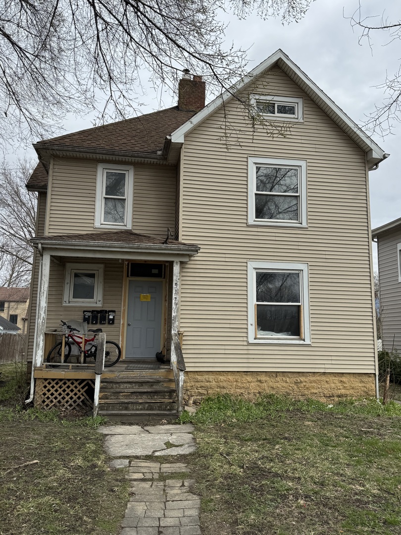706 Locust Street Sterling, IL 61081 - Photo 1 of 3 a front view of a house with garage
