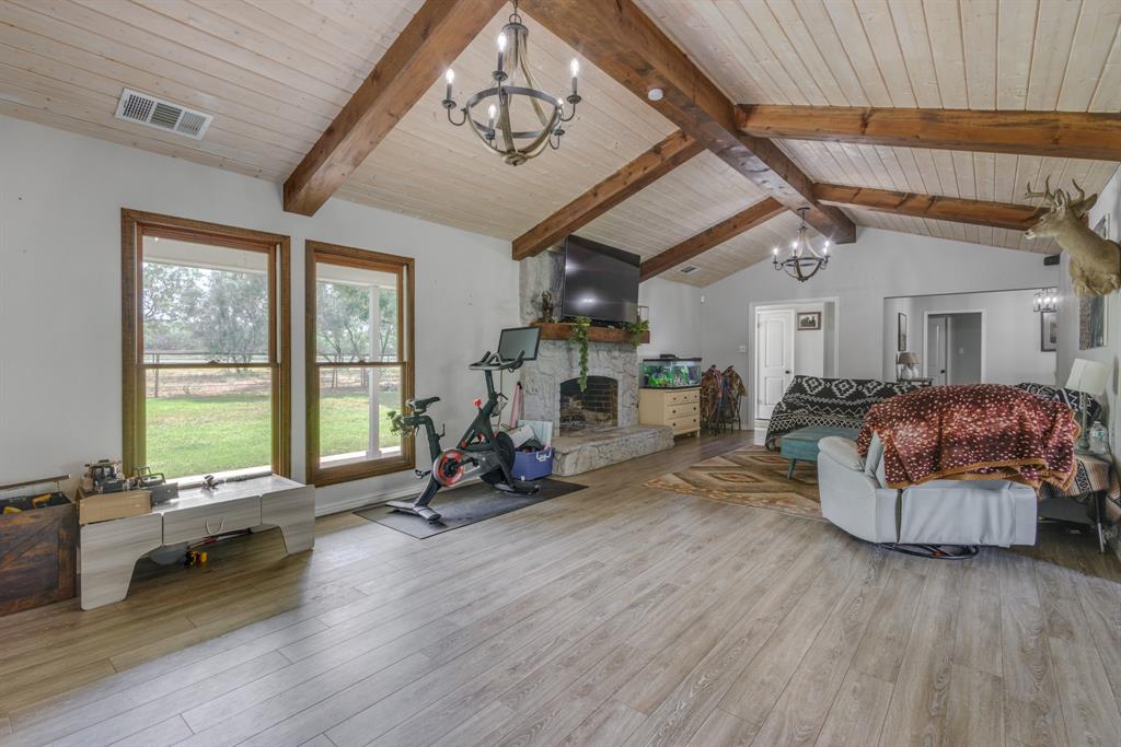 636 Clark Road Abilene, TX 79602 - Photo 6 of 40 a living room with furniture gym equipment and a large window