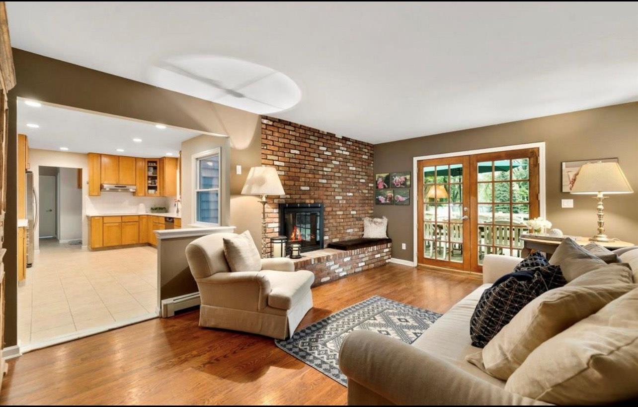 240 Plainview Road Woodbury, NY 11797 - Photo 6 of 22 a living room with furniture and a large window