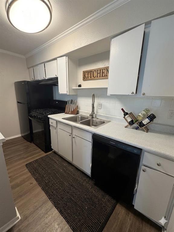 11457 Dennis Road, Unit 301 Dallas, TX 75229 - Photo 2 of 6 a kitchen with a sink and a mirror