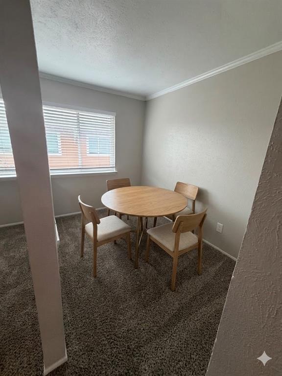 11457 Dennis Road, Unit 301 Dallas, TX 75229 - Photo 5 of 6 a view of a workspace with furniture and a window