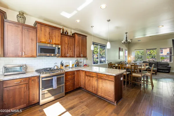 a kitchen with lots of counter top space and appliances