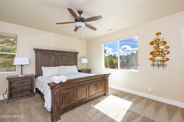a living room with a bed furniture and a window