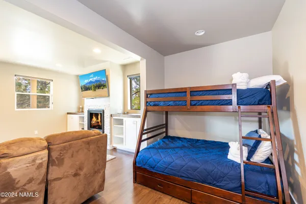 a bedroom with furniture and a fireplace