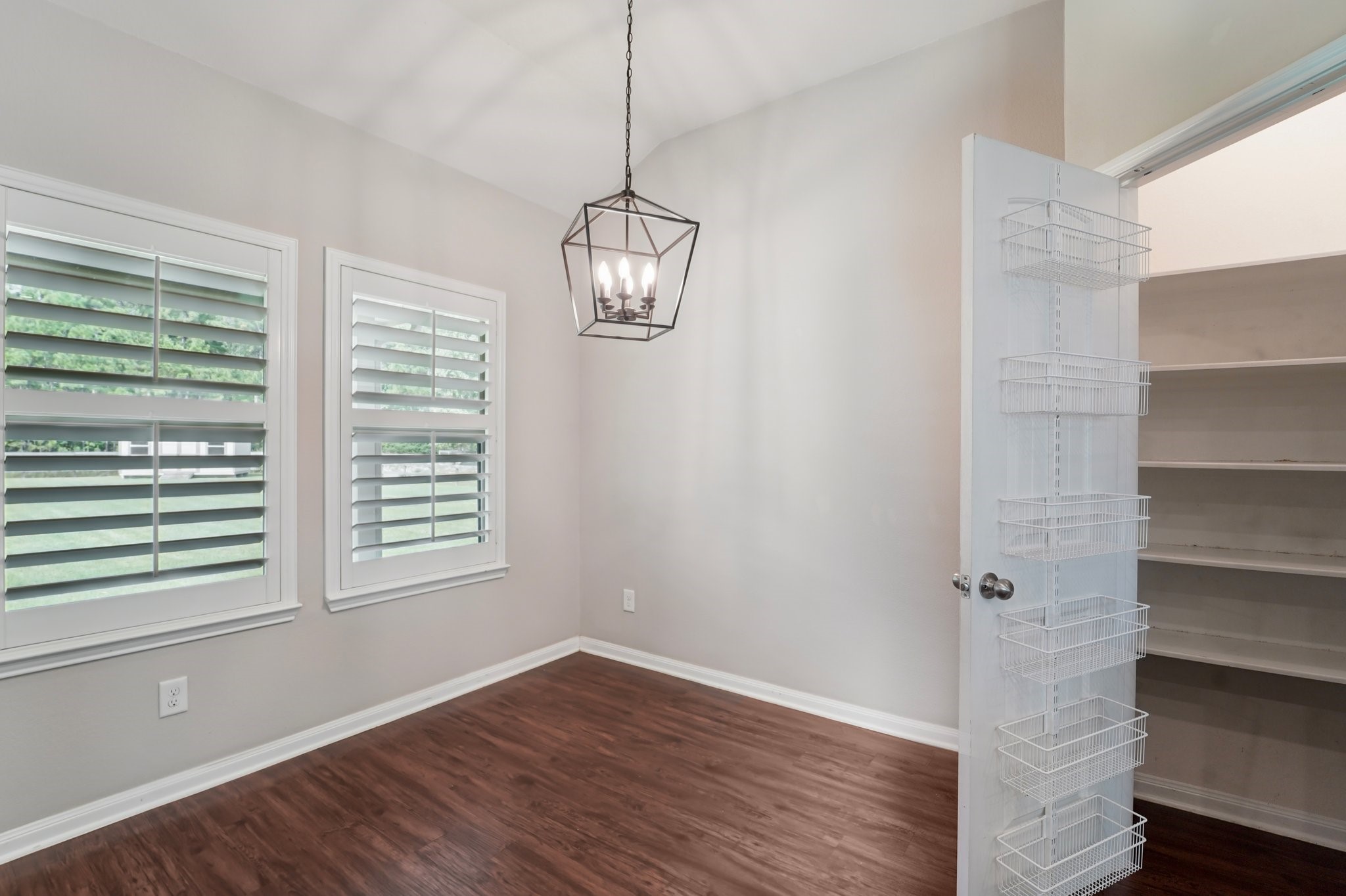 4542 Coues Deer Lane Conroe, TX 77303 - Photo 11 of 50 Spacious dining area with abundant natural light and an adjacent walk-in pantry for convenient storage.