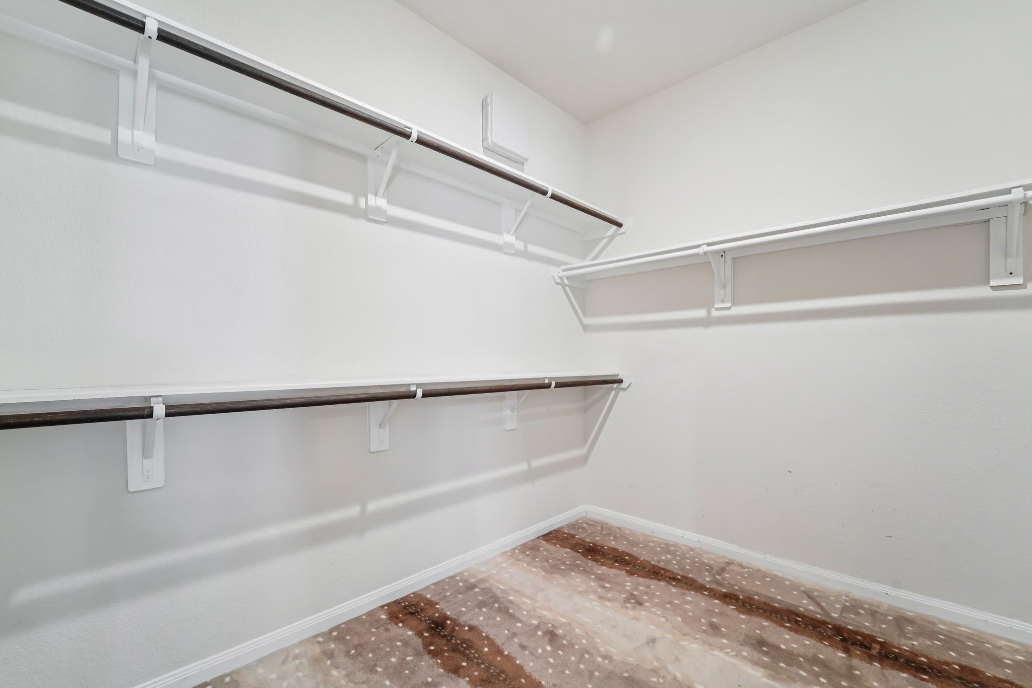 4542 Coues Deer Lane Conroe, TX 77303 - Photo 36 of 50 Spacious and well-organized primary closet, perfect for all your wardrobe needs.