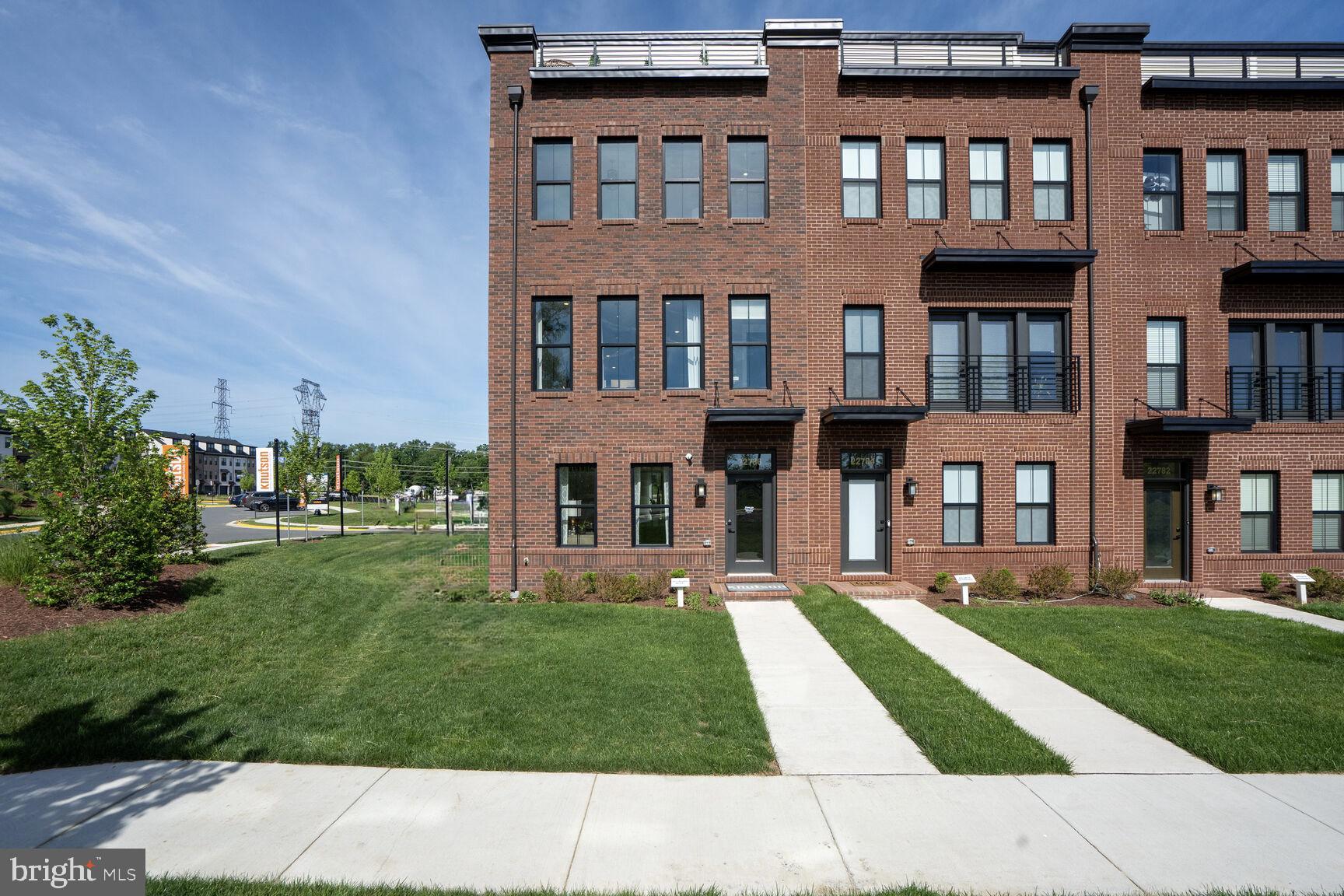 a front view of building with yard