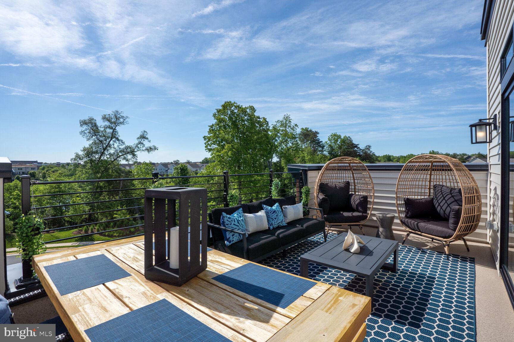 42116 Hazel Grv Terrace Ashburn, VA 20148 - Photo 13 of 21 a view of a terrace with wooden floor and outdoor seating