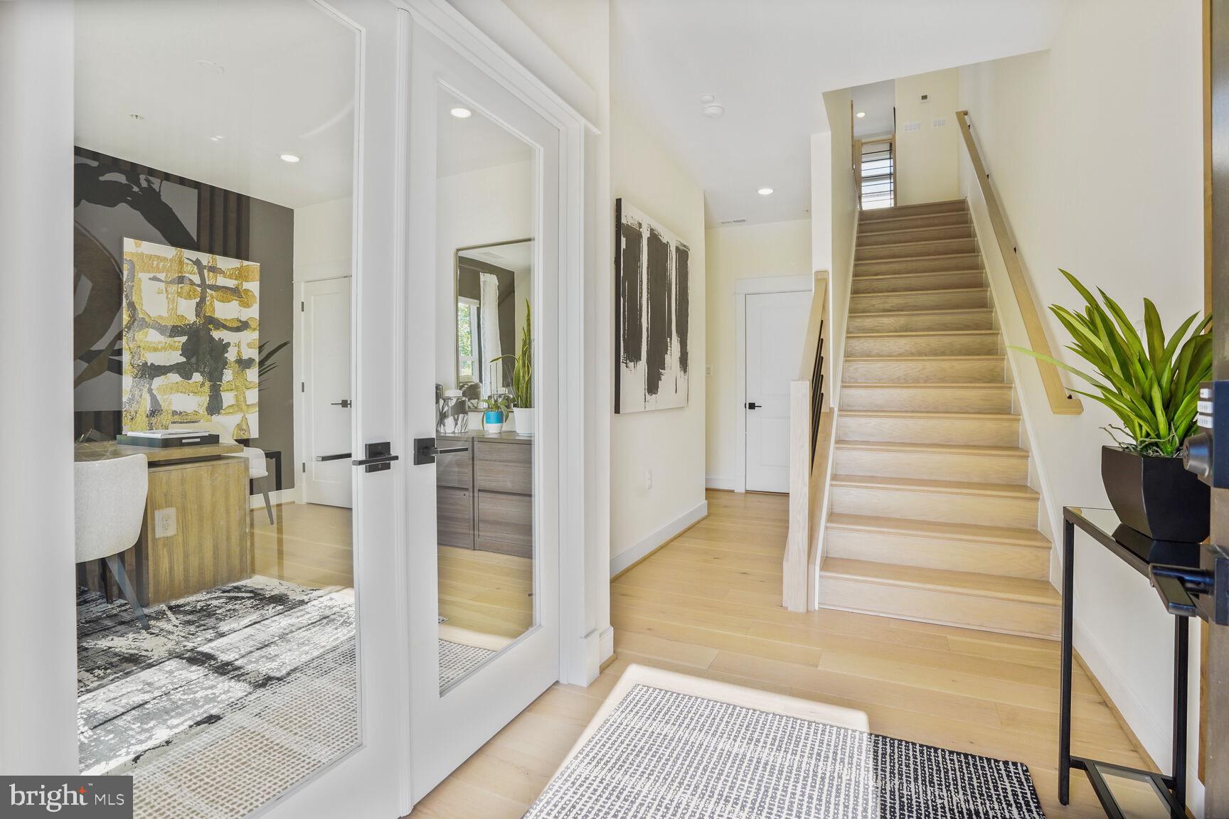 42116 Hazel Grv Terrace Ashburn, VA 20148 - Photo 2 of 21 a view of a hallway view with wooden floor and windows