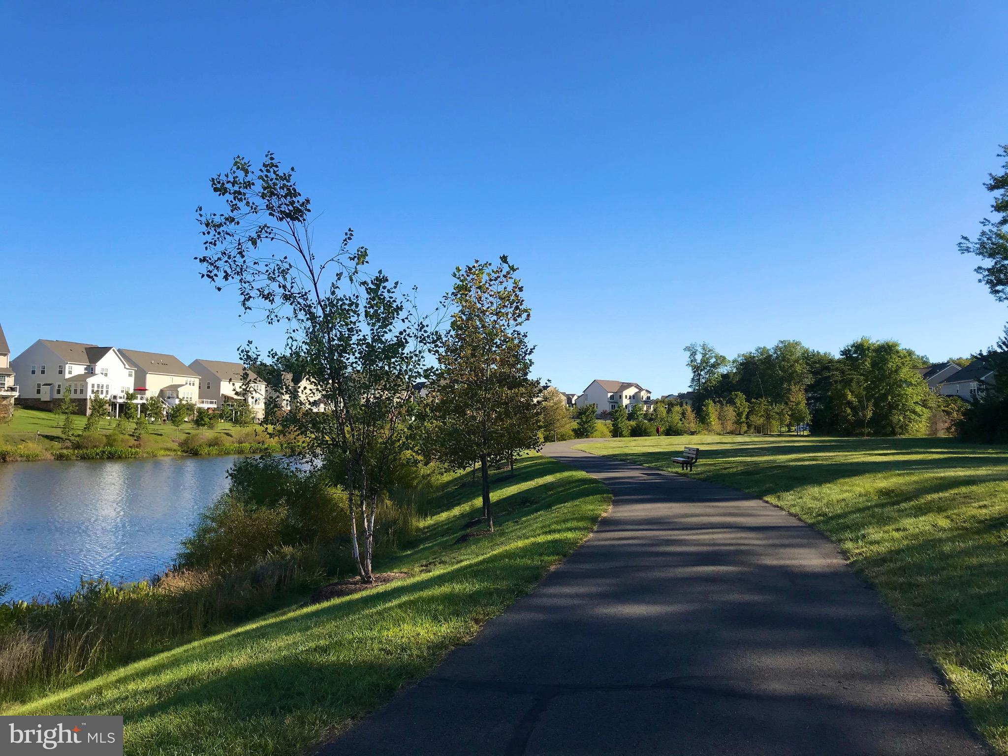 42116 Hazel Grv Terrace Ashburn, VA 20148 - Photo 21 of 21 a view of a lake with houses in the back
