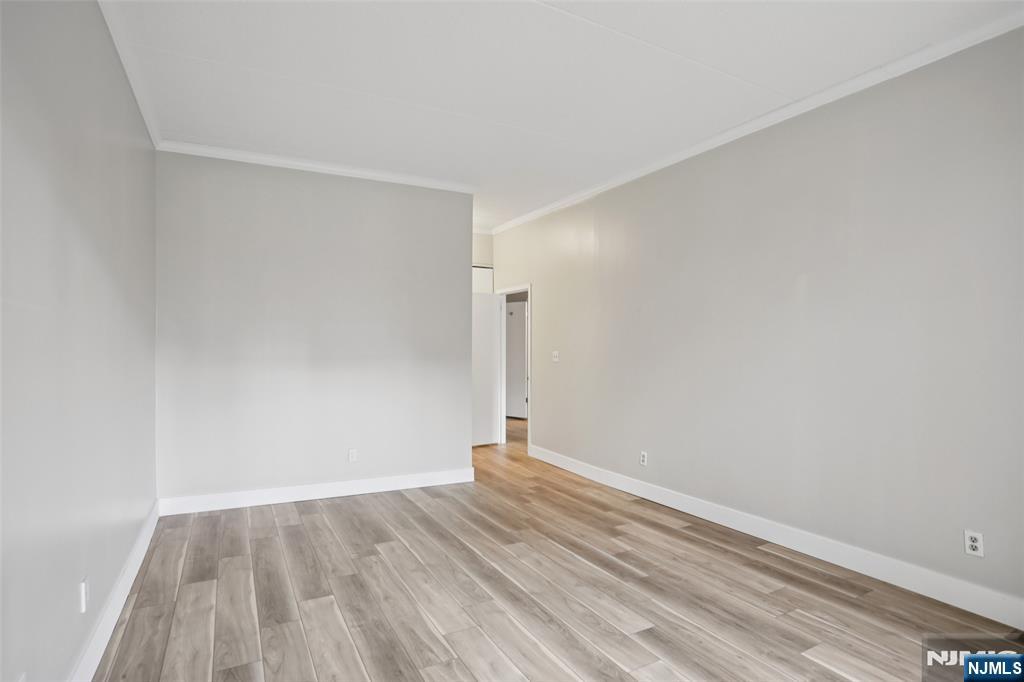 1077 River Road, Unit TH5 Edgewater, NJ 07020 - Photo 10 of 22 a view of empty room with wooden floor