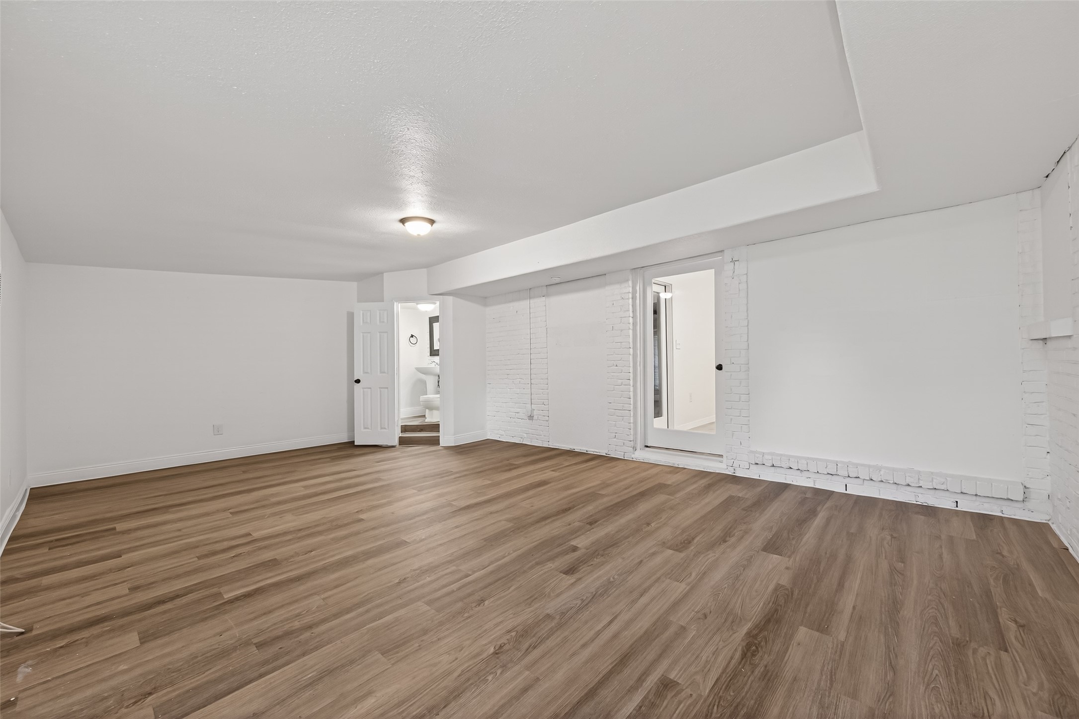 7718 Morley Street Houston, TX 77061 - Photo 25 of 35 a view of an empty room with wooden floor