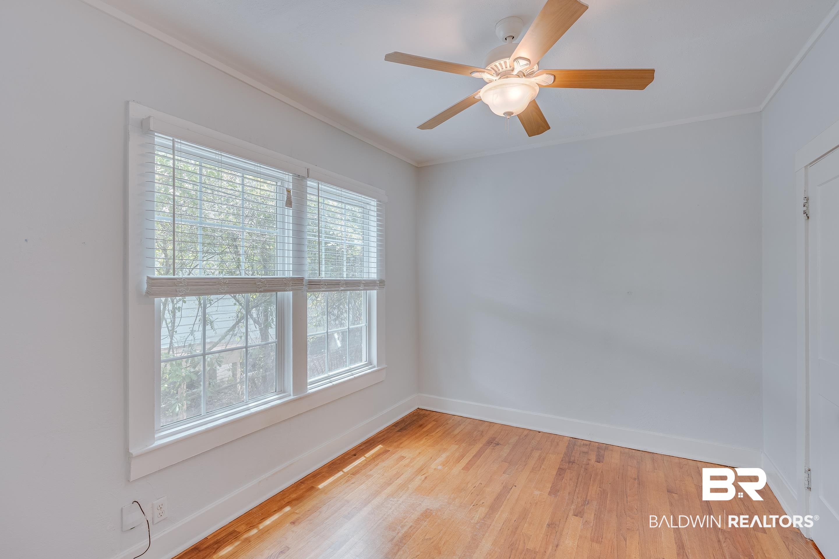 1852 Old Shell Road Mobile, AL 36607 - Photo 17 of 26 Spare room with ornamental molding, light wood-style floors, and ceiling fan