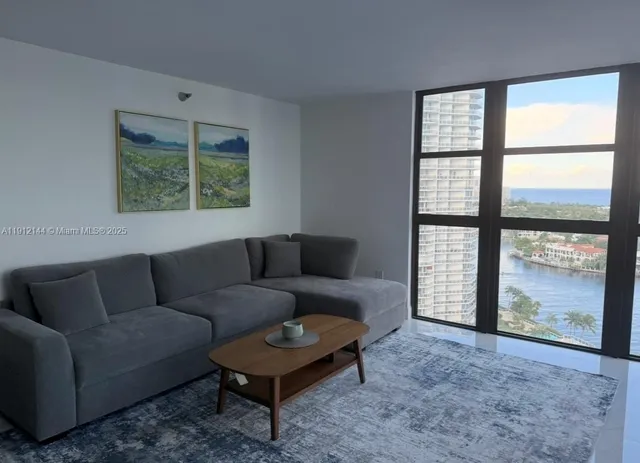 a living room with furniture and a window