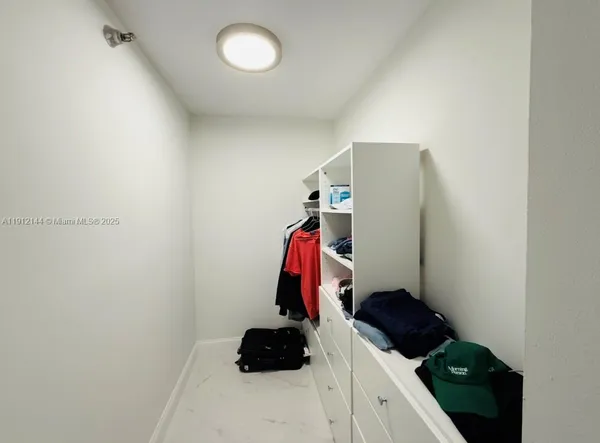 a room with a closet and storage