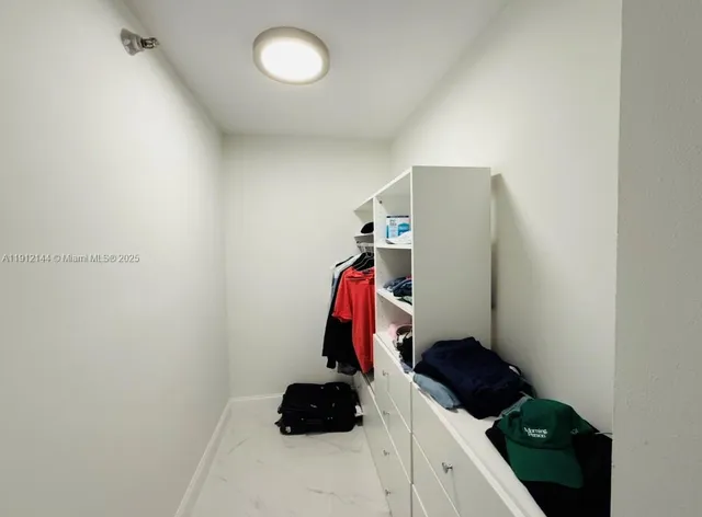 a room with a closet and storage