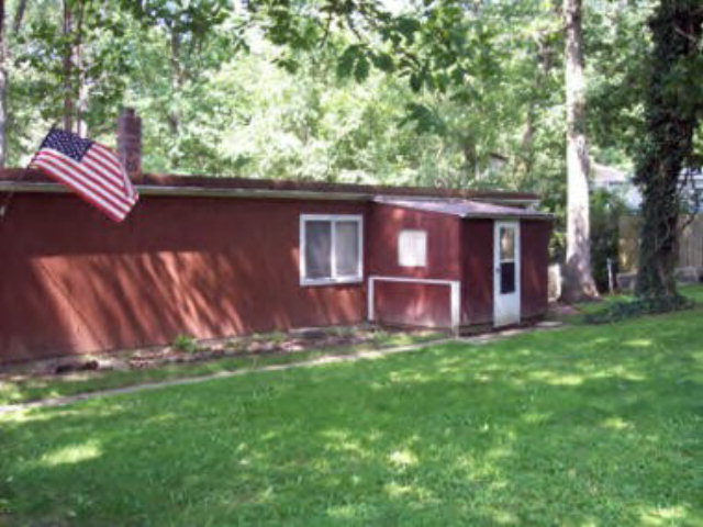 845 Polk Cutoff Polk, PA 16342 - Photo 1 of 1 a view of backyard with large trees and plants