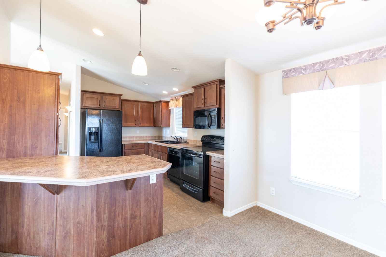 957 East Springer Avenue Ridgecrest, CA 93555 - Photo 8 of 31 a kitchen with stainless steel appliances granite countertop a sink refrigerator and cabinets