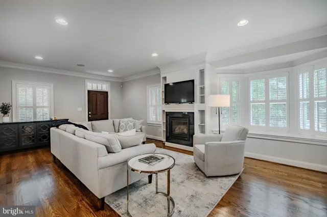 a kitchen with a table chairs and white cabinets