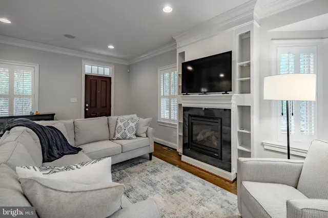 a kitchen with granite countertop kitchen island a center island a refrigerator and a wooden cabinets