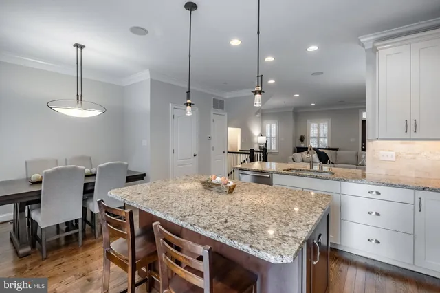 a dining table with chairs and wooden floor