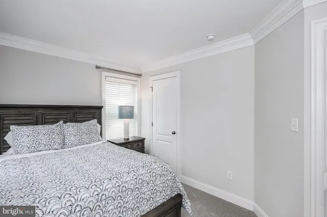 a bedroom with a large bed and a couch