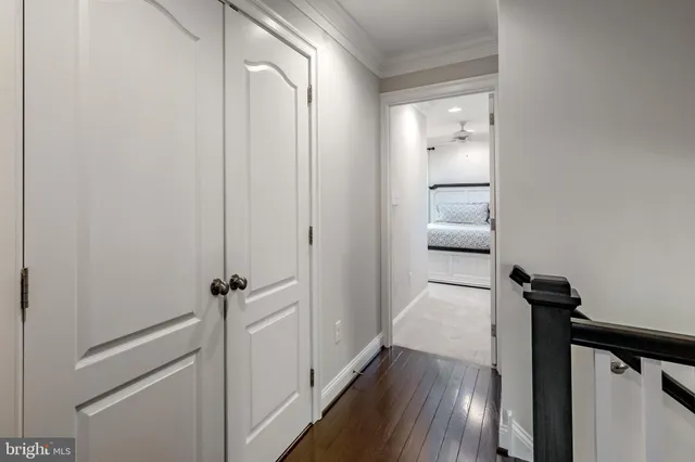 a room with a bed and a chandelier